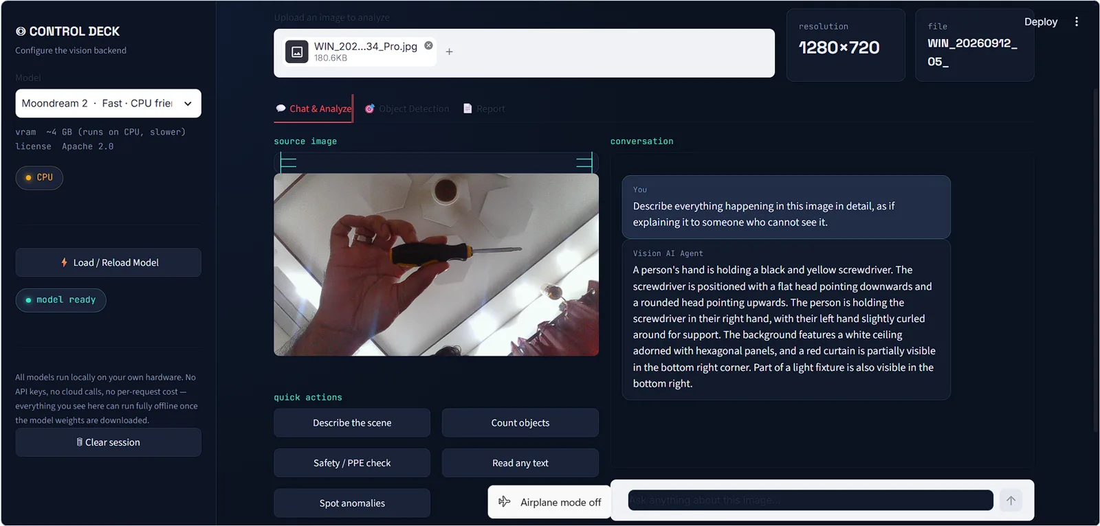 Vision AI Agent describing a photo of a hand holding a screwdriver, with quick action buttons